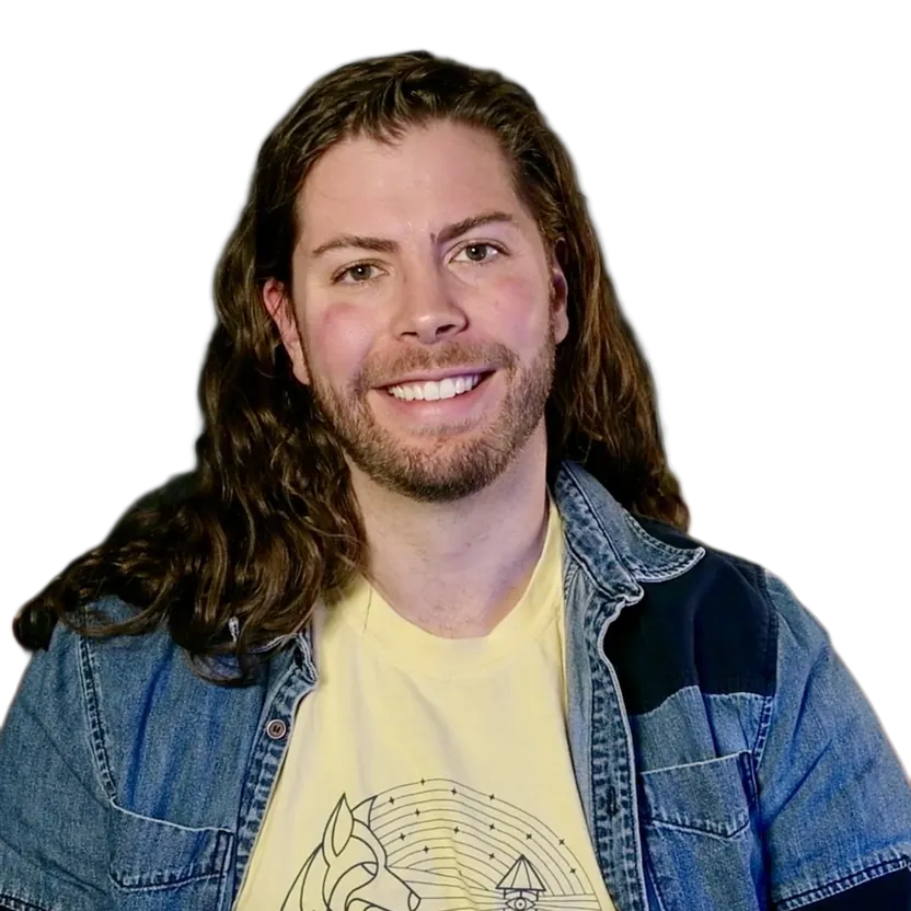 David Blocher, smiling, wearing a denim jacket over a yellow t-shirt